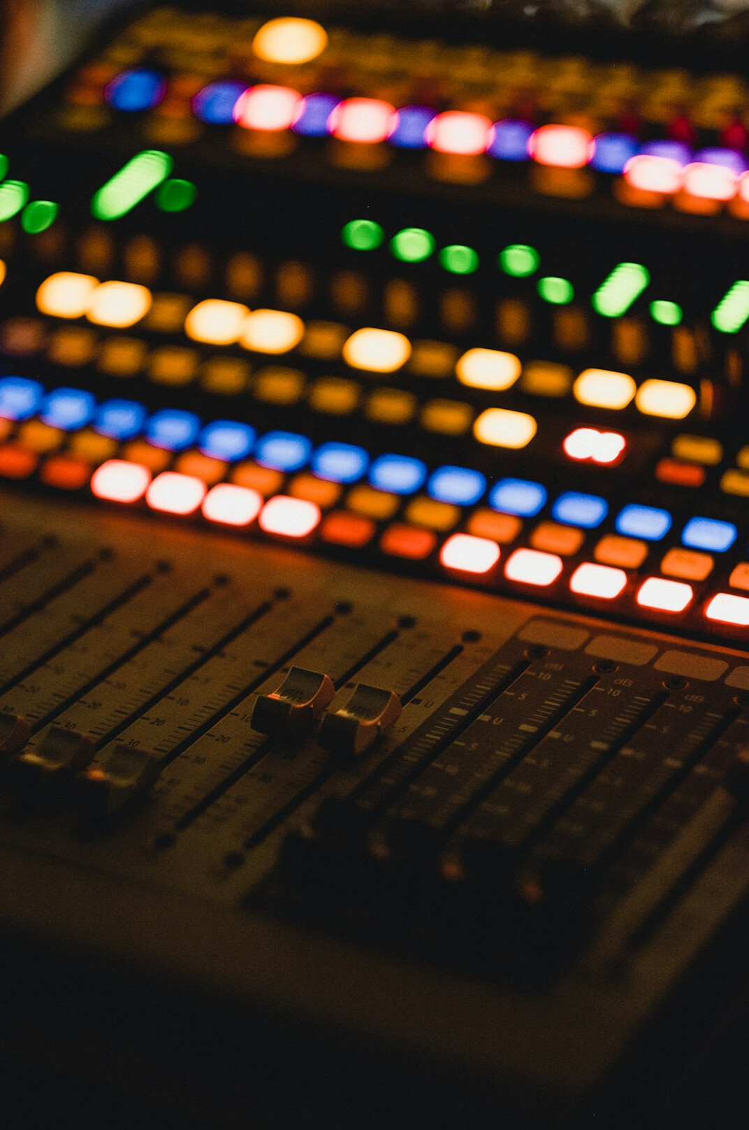 sound engineer at mixing console