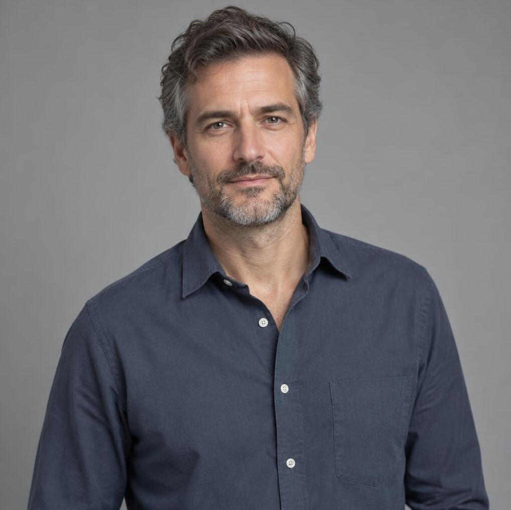 Portrait of a European man filmmaker and editor in a casual studio setting